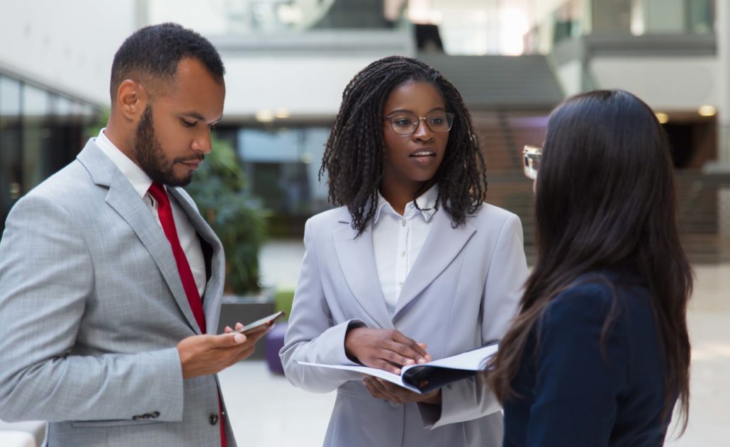 Successful diverse business people discussing contract