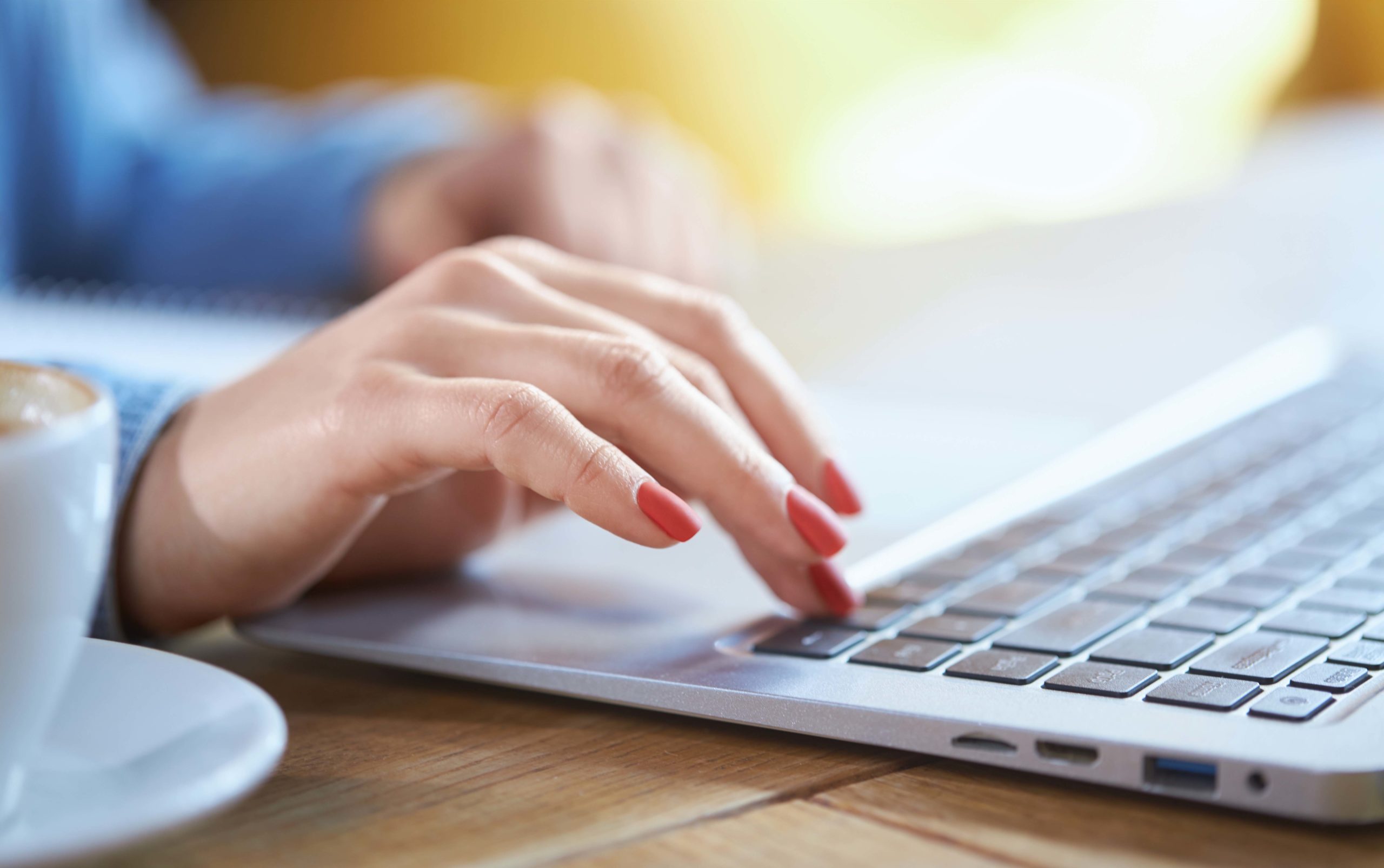 Business woman hand typing on laptop keyboard.