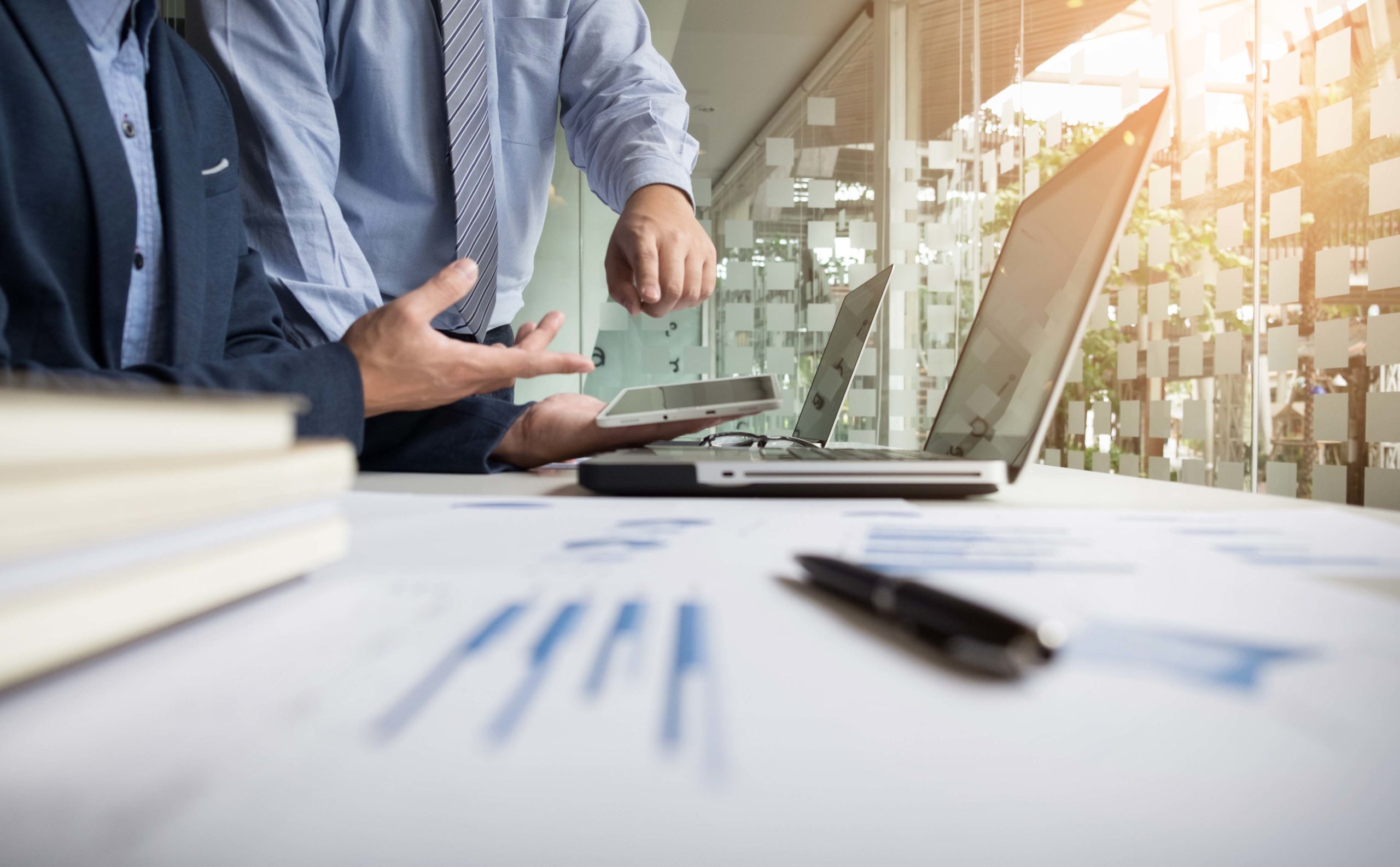 Business adviser analyzing financial figures denoting the progre
