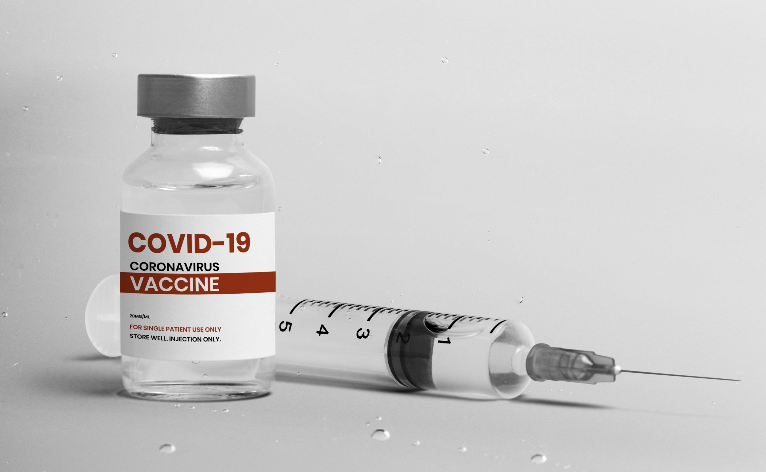 COVID-19 vaccine injection glass bottle with syringe