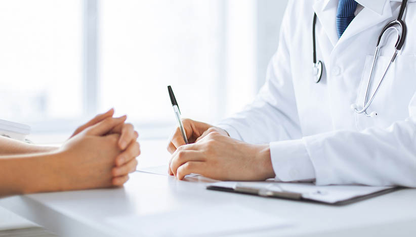 patient and doctor taking notes