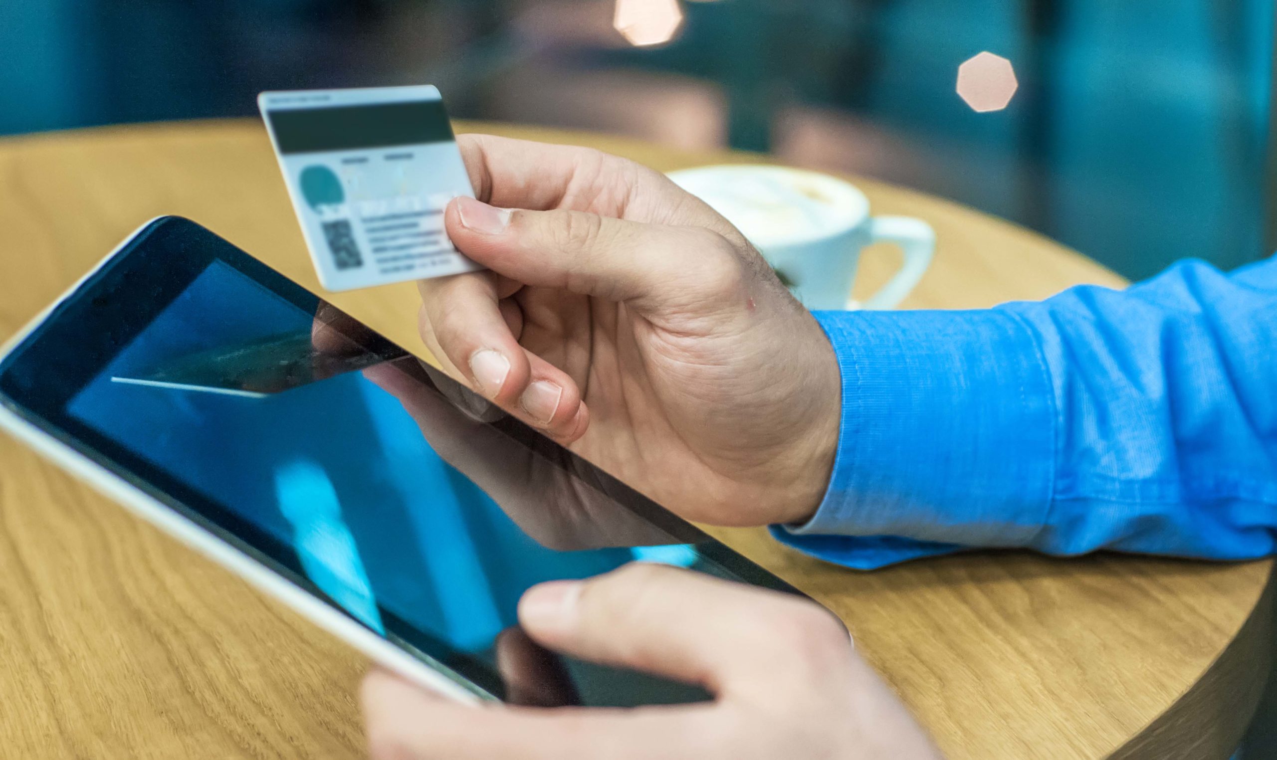 Businessman using a credit card and digital tablet for buying on