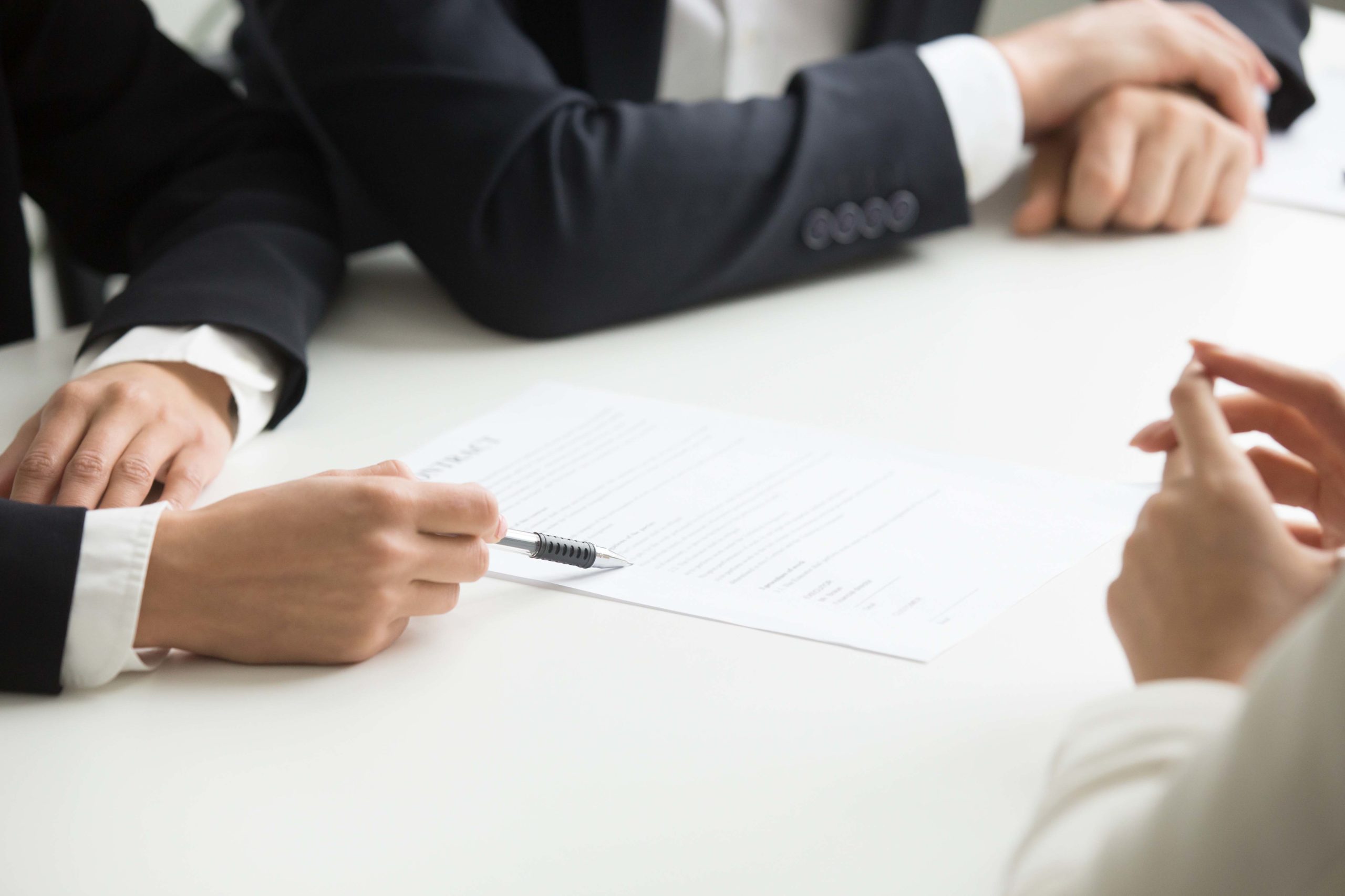 Negotiations about contract terms concept, hand pointing at docu