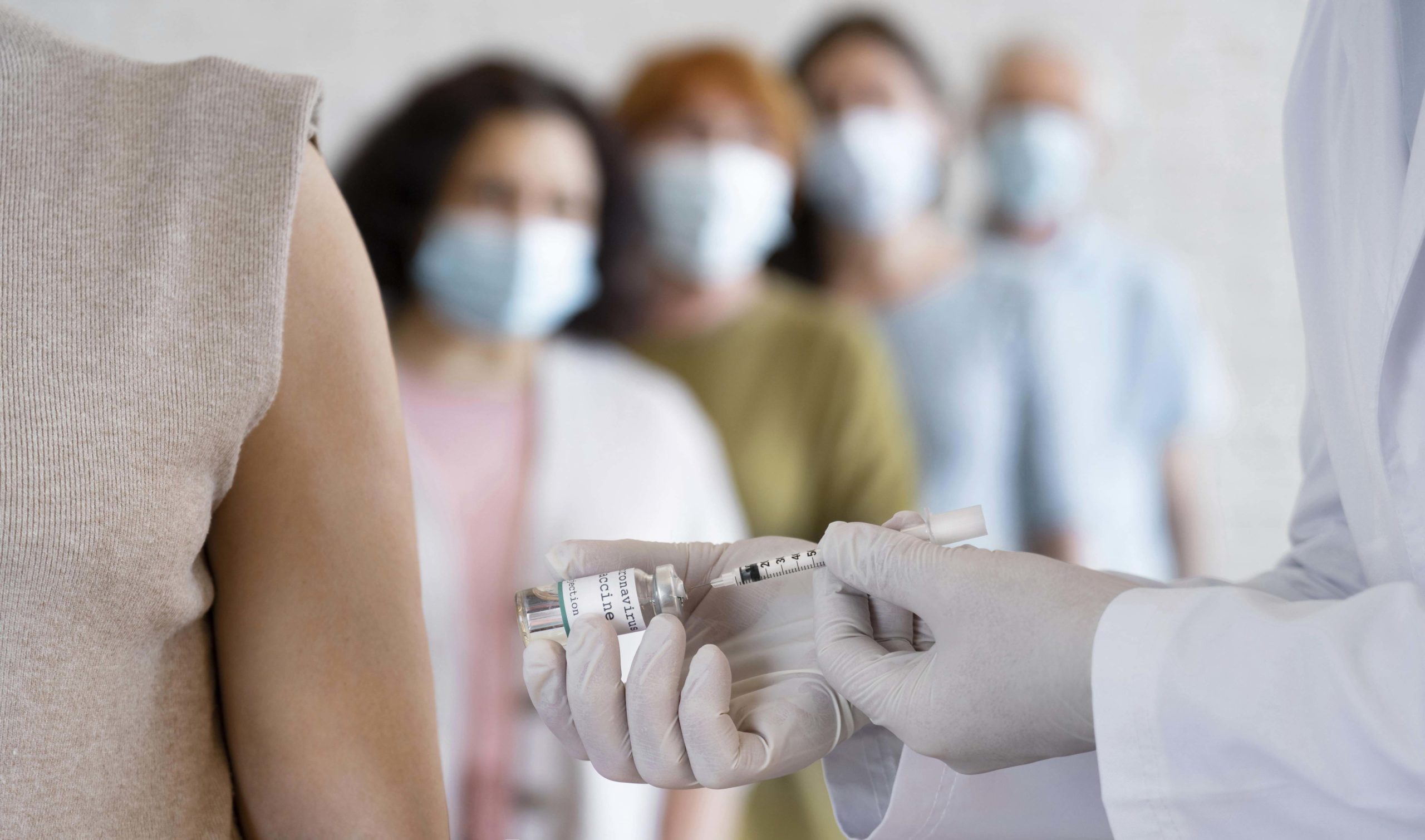 woman-getting-vaccine-shot-by-doctor