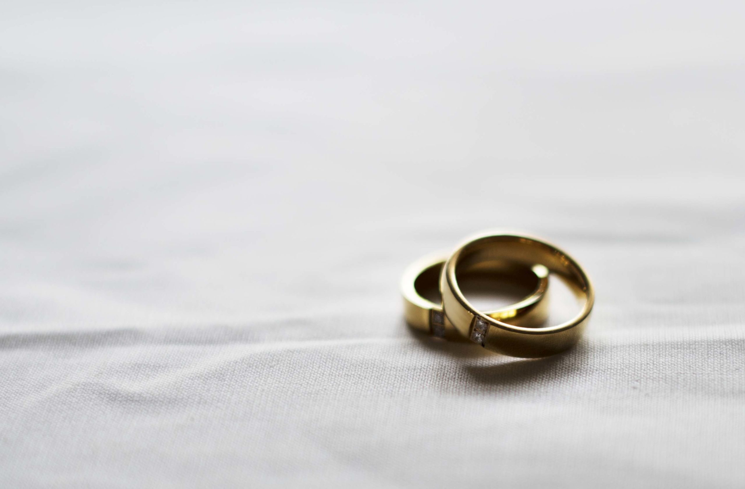 Two Gold Wedding Ring on White Background